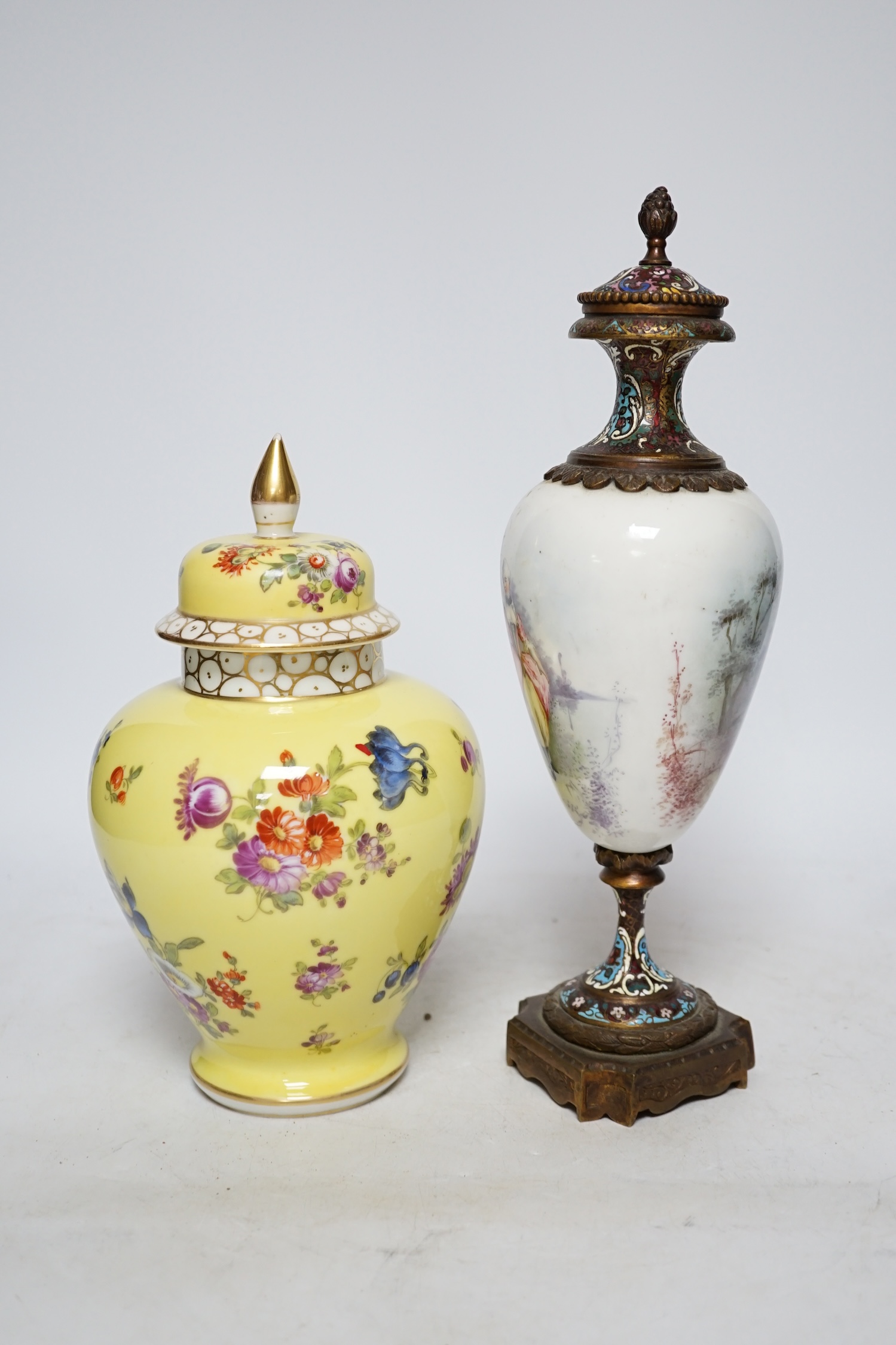 A 19th century French ormolu, enamel and porcelain urn and cover and a Dresden yellow urn and cover, tallest 31cm